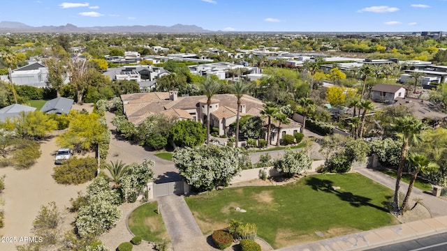 birds eye view of property with a residential view and a mountain view