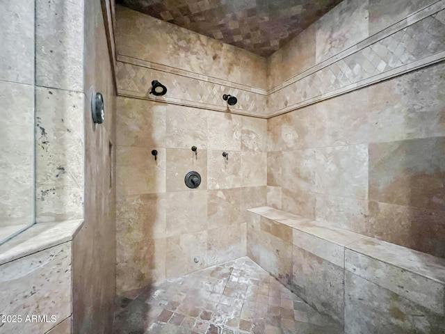 full bath featuring tiled shower