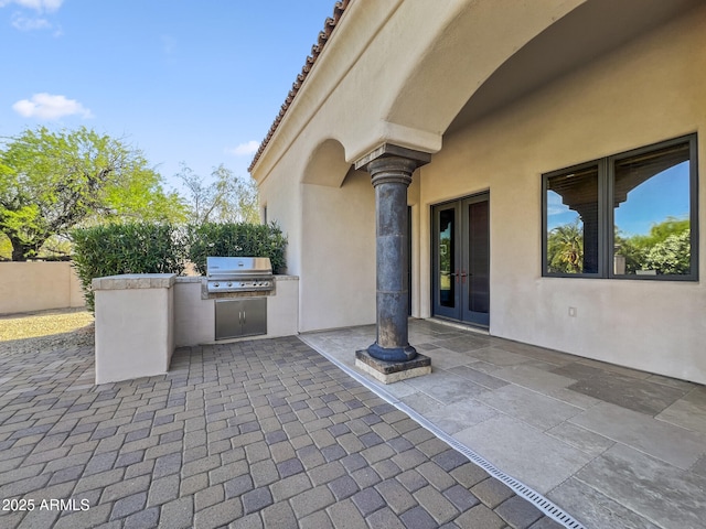 view of patio with french doors and area for grilling
