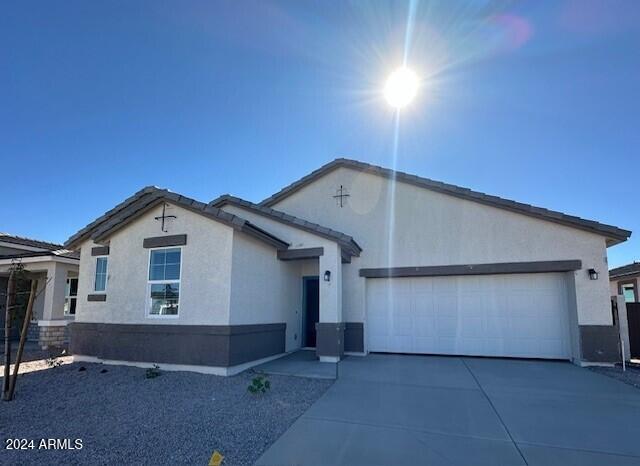 ranch-style home with a garage