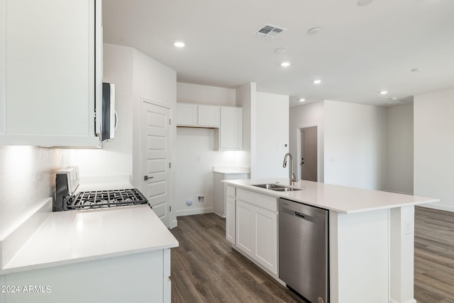 kitchen featuring stove, sink, a center island with sink, dishwasher, and white cabinetry