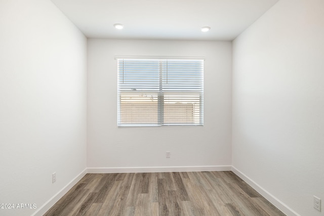 spare room with hardwood / wood-style flooring