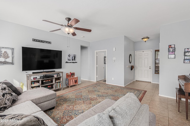 tiled living room featuring ceiling fan