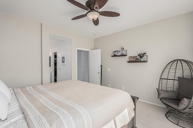 bedroom featuring ceiling fan and carpet