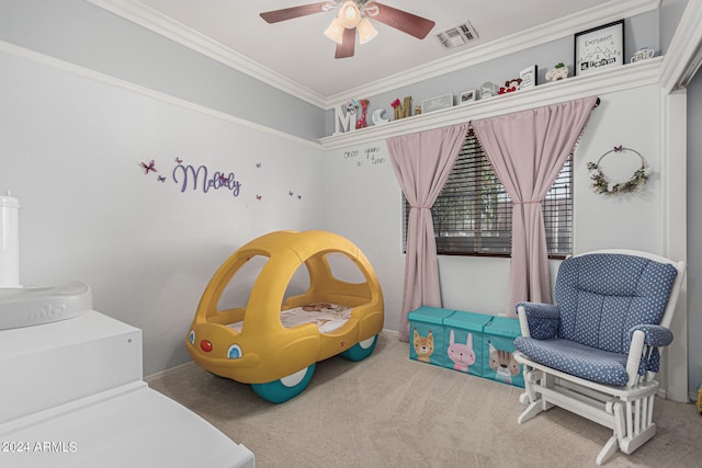 bedroom with carpet floors, ornamental molding, and ceiling fan