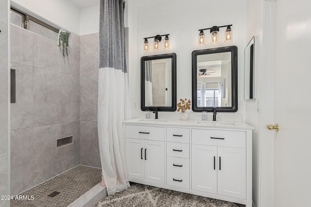 bathroom featuring a shower with shower curtain, vanity, and ceiling fan