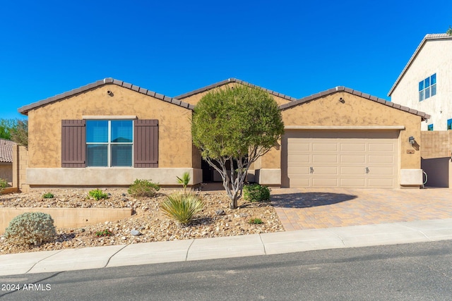 view of front of property with a garage