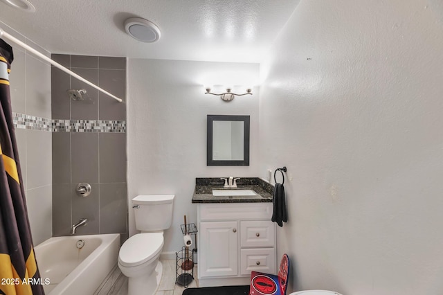 full bathroom featuring vanity, tiled shower / bath, a textured ceiling, and toilet