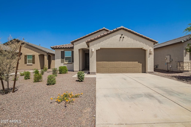 3036 E Riding Boot Way, San Tan Valley, AZ 85140 - mediterranean / spanish house featuring stucco siding, an attached garage, a tile roof, and concrete driveway
