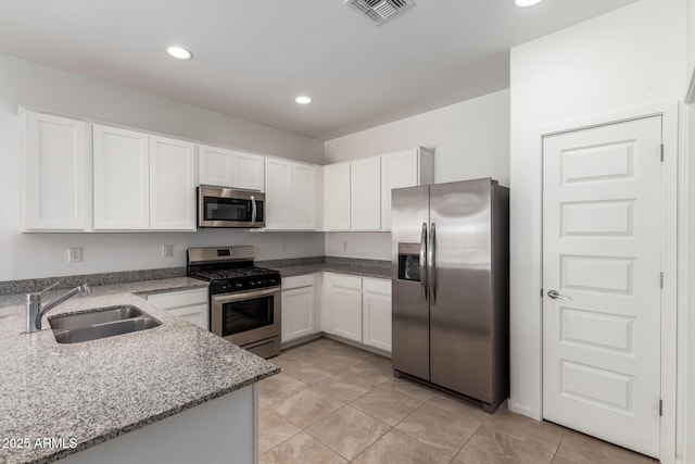 3036 E Riding Boot Way, San Tan Valley, AZ 85140 - kitchen featuring appliances with stainless steel finishes, a sink, white cabinets, and recessed lighting