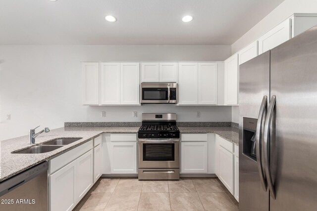 3036 E Riding Boot Way, San Tan Valley, AZ 85140 - kitchen with appliances with stainless steel finishes, a sink, white cabinetry, light tile patterned flooring, and recessed lighting