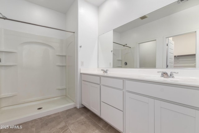 3036 E Riding Boot Way, San Tan Valley, AZ 85140 - bathroom featuring a shower, tile patterned floors, and double vanity
