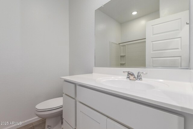 3036 E Riding Boot Way, San Tan Valley, AZ 85140 - bathroom featuring toilet, vanity, tile patterned flooring, baseboards, and recessed lighting