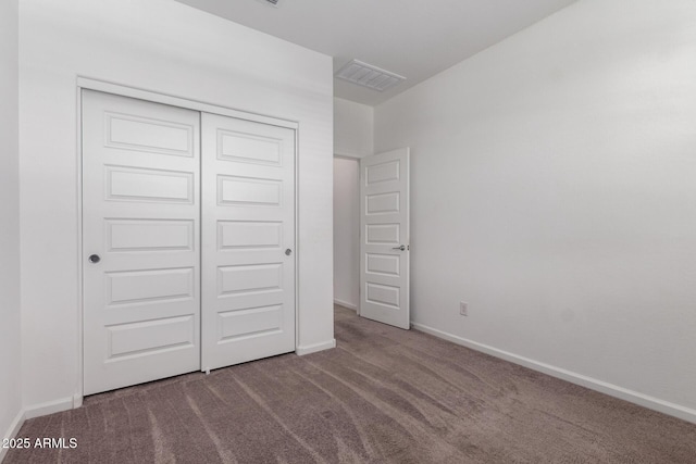 3036 E Riding Boot Way, San Tan Valley, AZ 85140 - unfurnished bedroom featuring carpet flooring, a closet, and baseboards