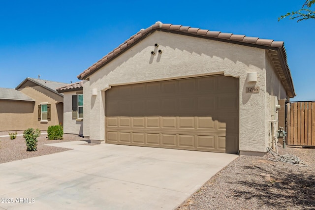 3036 E Riding Boot Way, San Tan Valley, AZ 85140 - mediterranean / spanish-style house with a tiled roof, stucco siding, a garage, and driveway