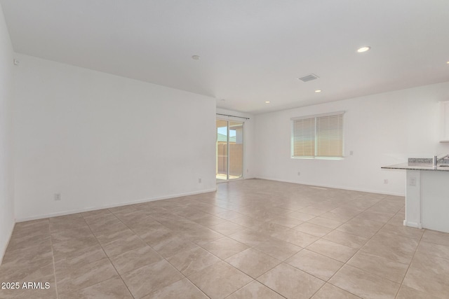 3036 E Riding Boot Way, San Tan Valley, AZ 85140 - spare room featuring light tile patterned flooring, recessed lighting, and baseboards