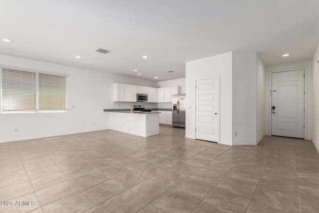 3036 E Riding Boot Way, San Tan Valley, AZ 85140 - unfurnished living room featuring recessed lighting, baseboards, and light tile patterned floors