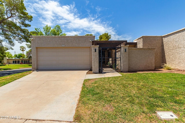 view of front of house with a garage and a front lawn