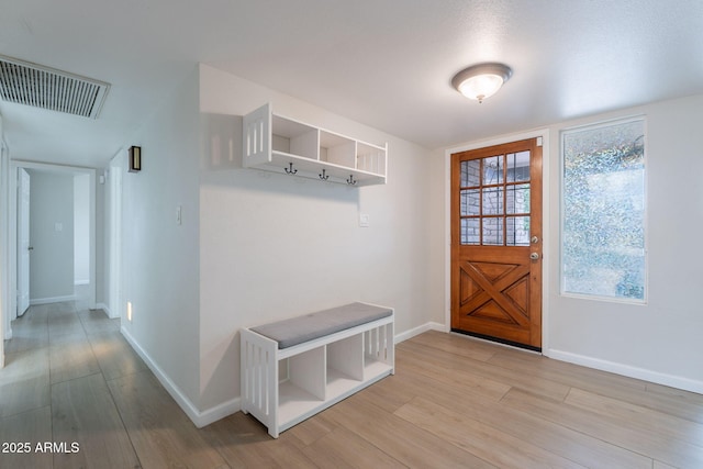 mudroom featuring baseboards and light wood-type flooring