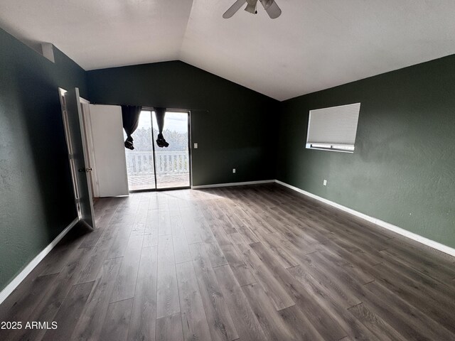 unfurnished room with lofted ceiling, ceiling fan, baseboards, and wood finished floors