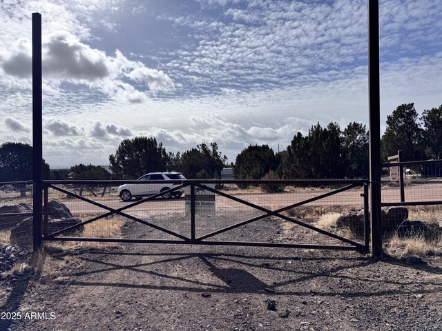 view of gate with fence