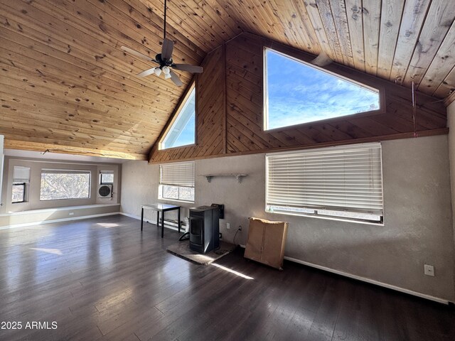 interior space featuring baseboards, wooden ceiling, dark wood-type flooring, a wood stove, and high vaulted ceiling