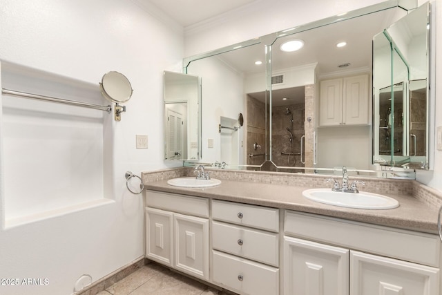38 E Calavar Rd, Phoenix, AZ 85022 - bathroom with crown molding, double vanity, a stall shower, tile patterned floors, and recessed lighting