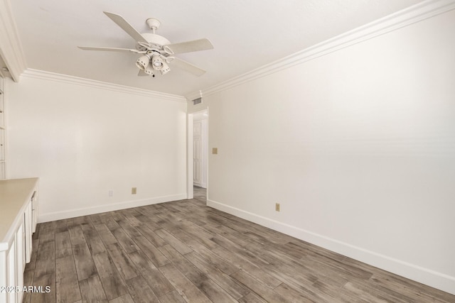 38 E Calavar Rd, Phoenix, AZ 85022 - empty room featuring ceiling fan, ornamental molding, and dark wood finished floors