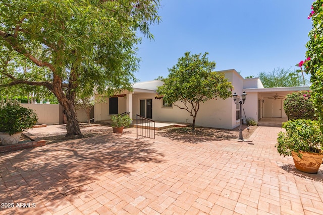 38 E Calavar Rd, Phoenix, AZ 85022 - rear view of house featuring a patio, stucco siding, and ceiling fan