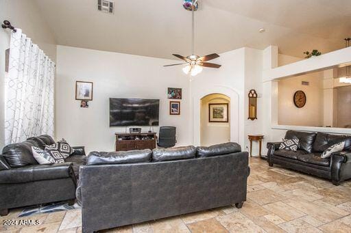 living room featuring high vaulted ceiling and ceiling fan