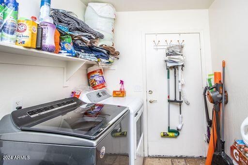 clothes washing area with washing machine and clothes dryer