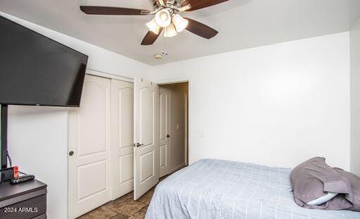 bedroom with a closet and ceiling fan