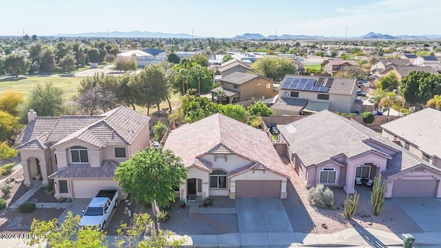 birds eye view of property featuring a mountain view