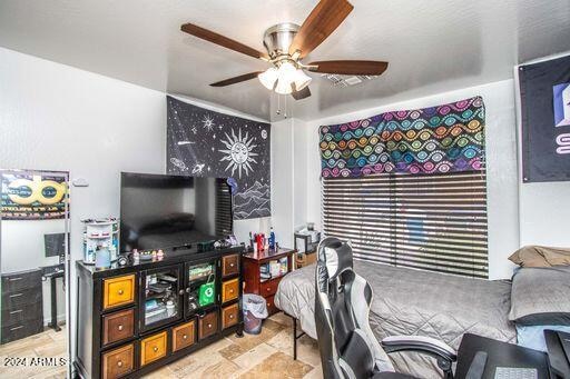 bedroom featuring ceiling fan