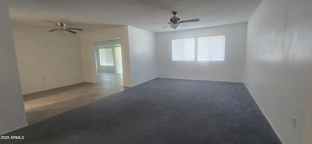 13816 N 103rd Ave, Sun City, AZ 85351 - carpeted empty room with a ceiling fan and tile patterned flooring