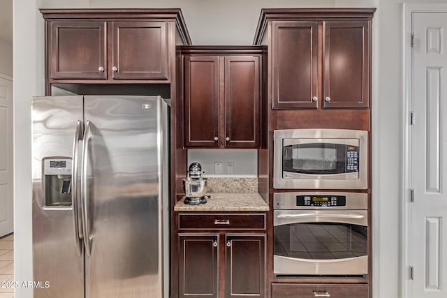 27105 W Marco Polo Rd, Buckeye, AZ 85396 - kitchen with stainless steel appliances and dark brown cabinets