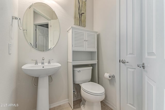 27105 W Marco Polo Rd, Buckeye, AZ 85396 - half bath with toilet, baseboards, a sink, and tile patterned flooring
