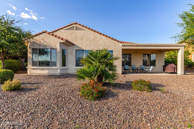 27105 W Marco Polo Rd, Buckeye, AZ 85396 - back of property with stucco siding and a patio area