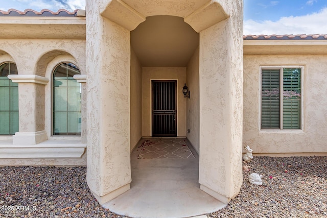 27105 W Marco Polo Rd, Buckeye, AZ 85396 - property entrance featuring stucco siding and a tile roof