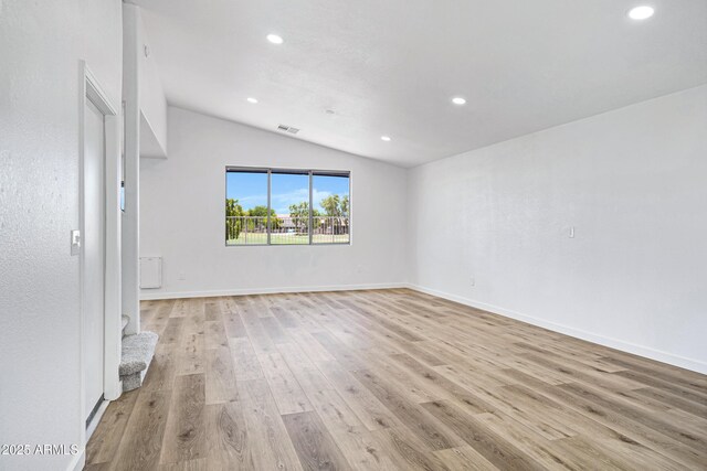 1236 S Boulder St Unit C, Gilbert, AZ 85296 - empty room with vaulted ceiling, recessed lighting, and light wood-style floors