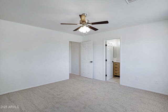 1236 S Boulder St Unit C, Gilbert, AZ 85296 - unfurnished bedroom featuring light carpet, connected bathroom, and a ceiling fan