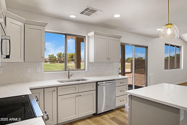 1236 S Boulder St Unit C, Gilbert, AZ 85296 - kitchen featuring stainless steel dishwasher, range, light wood finished floors, plenty of natural light, and recessed lighting