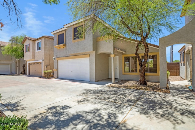 1236 S Boulder St Unit C, Gilbert, AZ 85296 - view of front facade with stucco siding, a garage, and concrete driveway