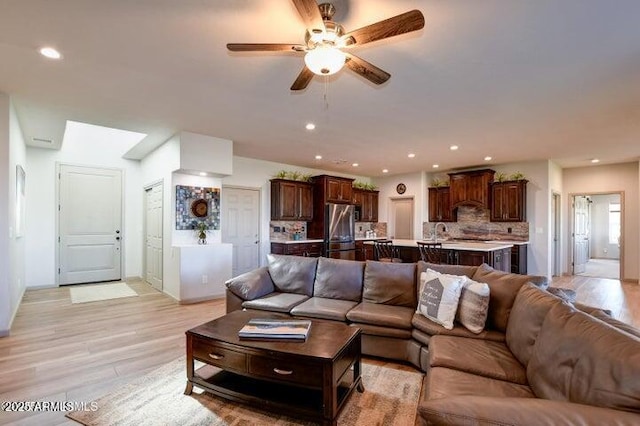130 Brenna Dr, Chino Valley, AZ 86323 - living area with a ceiling fan, light wood finished floors, recessed lighting, and baseboards
