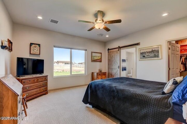 130 Brenna Dr, Chino Valley, AZ 86323 - carpeted bedroom featuring a barn door, recessed lighting, a ceiling fan, baseboards, and ensuite bathroom