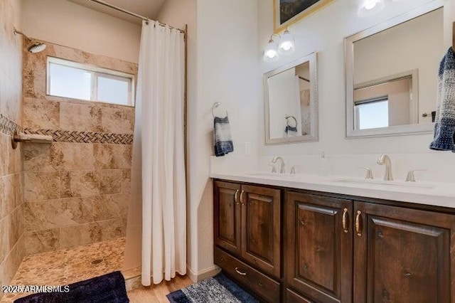 130 Brenna Dr, Chino Valley, AZ 86323 - bathroom featuring healthy amount of natural light, tiled shower, and double vanity
