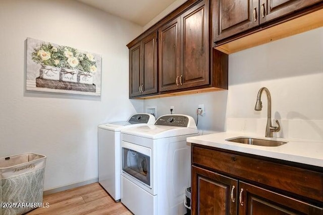 130 Brenna Dr, Chino Valley, AZ 86323 - laundry area with independent washer and dryer, cabinet space, and light wood-style flooring