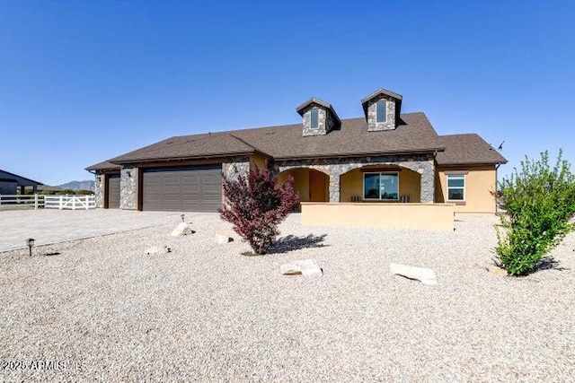 130 Brenna Dr, Chino Valley, AZ 86323 - view of front facade featuring an attached garage, driveway, and a porch