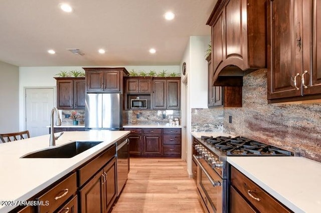 130 Brenna Dr, Chino Valley, AZ 86323 - kitchen featuring stainless steel appliances, a sink, recessed lighting, light countertops, and light wood-style floors