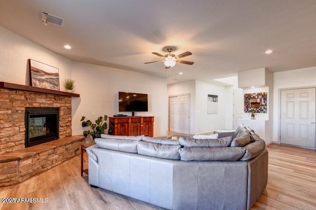 130 Brenna Dr, Chino Valley, AZ 86323 - living room with a ceiling fan, light wood finished floors, recessed lighting, and a stone fireplace